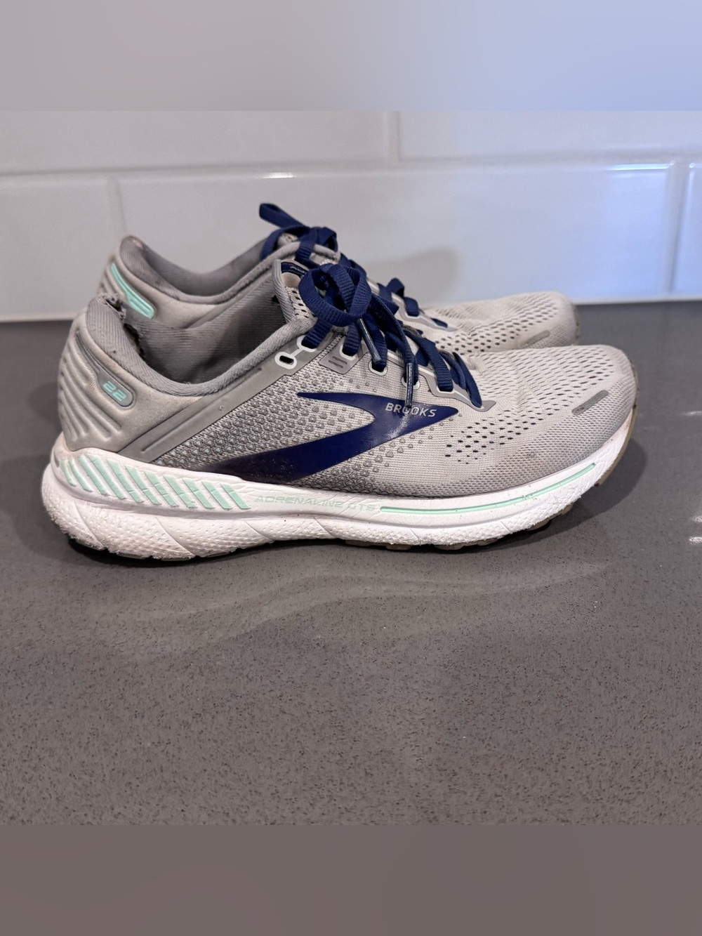 Brooks Light Gray Running Shoes with Navy and Mint Accents